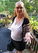 Maggie Mae is an American granny that loves to please her shaved pussy