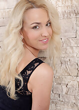 Horny blonde Eve Valentine takes off her sexy black lingerie