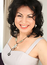 Mature mama Nataly slips out of her dress