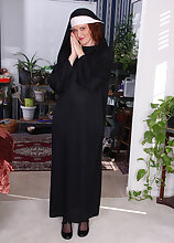 Sexy nun Roxanne Clemmens has a great habit of stripping and masturbating