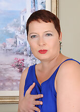 Short haired hottie Kali Karinena slips out of her bra and panties to play