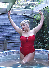 Bubbly busty Danielle T pours water over those big soft titties in the pool