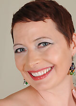 Short haired sweetheart Kali Karinena does the laundry and gets naked