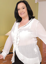 Elegant 48 year old Ria Black stuffs her pussy with a big black dong