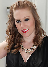 31 year old Amber Carlisle slides out of her elegant black dress