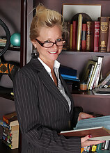 Watch blonde 44 year old Heidi Gallo spread her legs in the library