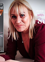 Mature.nl - 59 year old British GILF Secret loves to play with her shaved pussy at home on the sofa